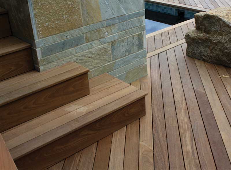 Striking hardwood pool deck constructed with Ipe Clip® edge mount fasteners